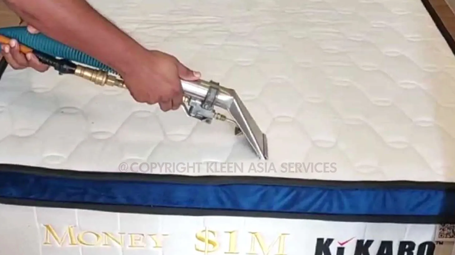 technician cleaning mattress