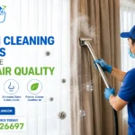 Professional curtain cleaning service technician using a stainless steel steam extraction upholstery tool to deep clean curtains, removing dust, allergens, bacteria and odors